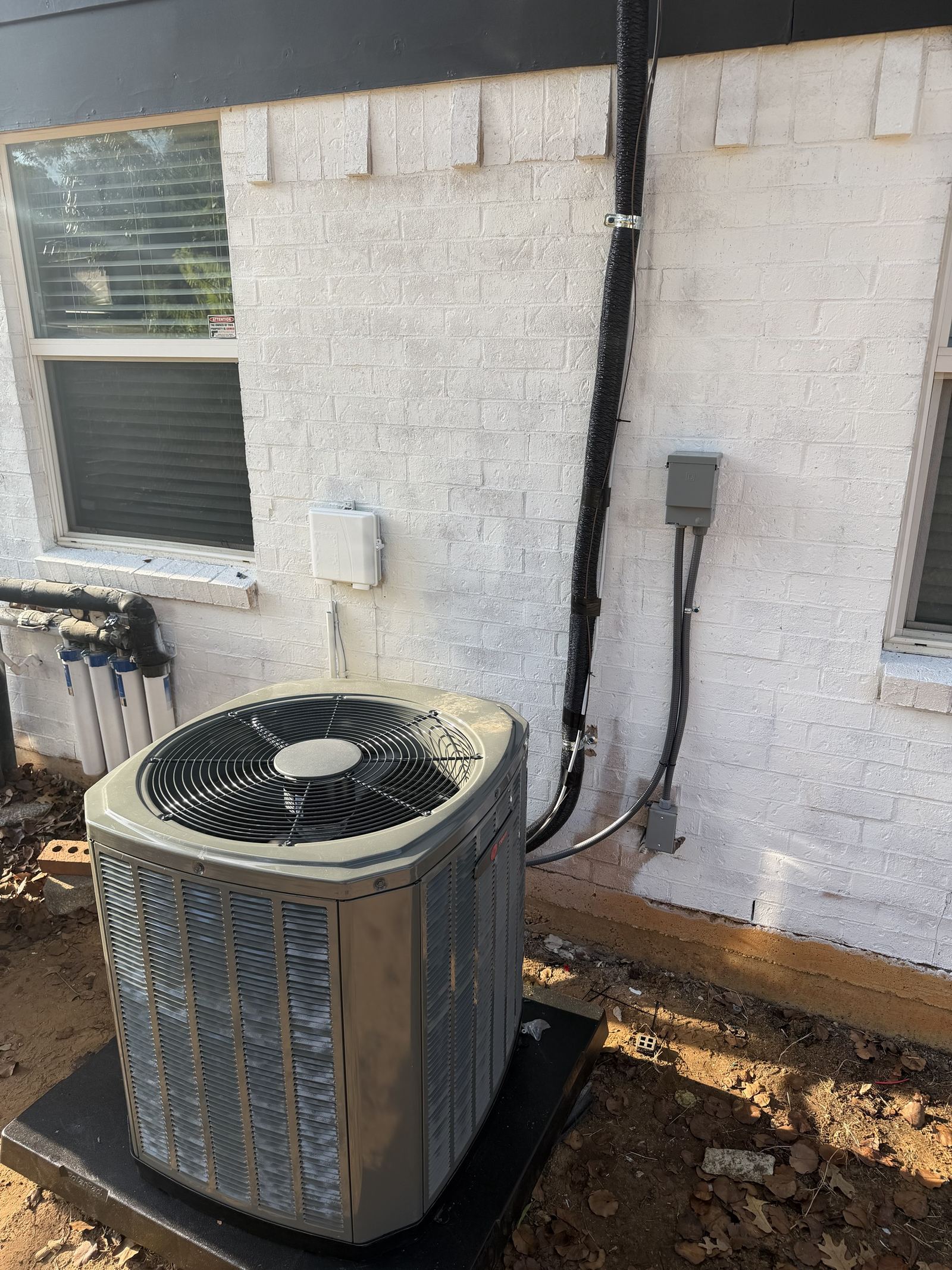Completed AC condenser install with new electrical whip